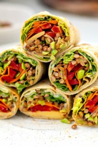 Veggie Wrap with healthy high-protein filling of lentils, edamame beans and hummus with lots of vegetables.