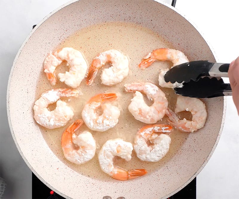 Shallow fried shrimp in a pan