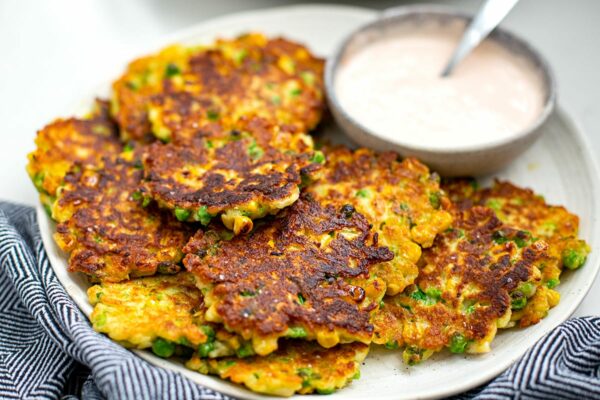 Halloumi Fritters With Peas & Corn with tomato garlic aioli on the side