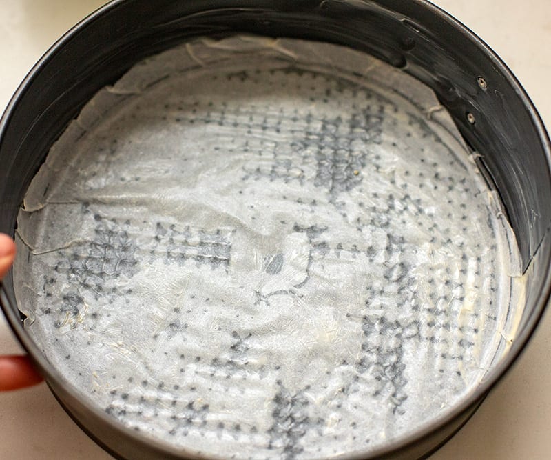 Grease and line the cake pan