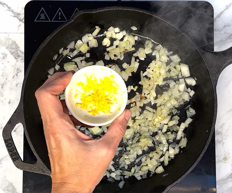 Saute garlic and lemon in a skillet