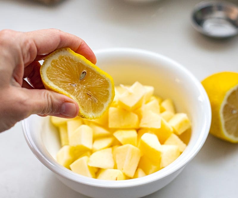 Drizzle cut apple with lemon juice