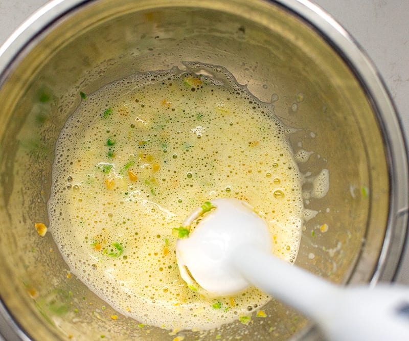Blending eggs with peas and corn