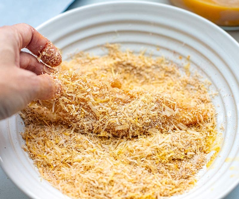 Coat chicken tenders with Parmesan crumbs