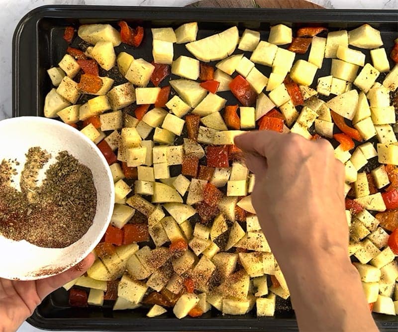 Add spices to potatoes