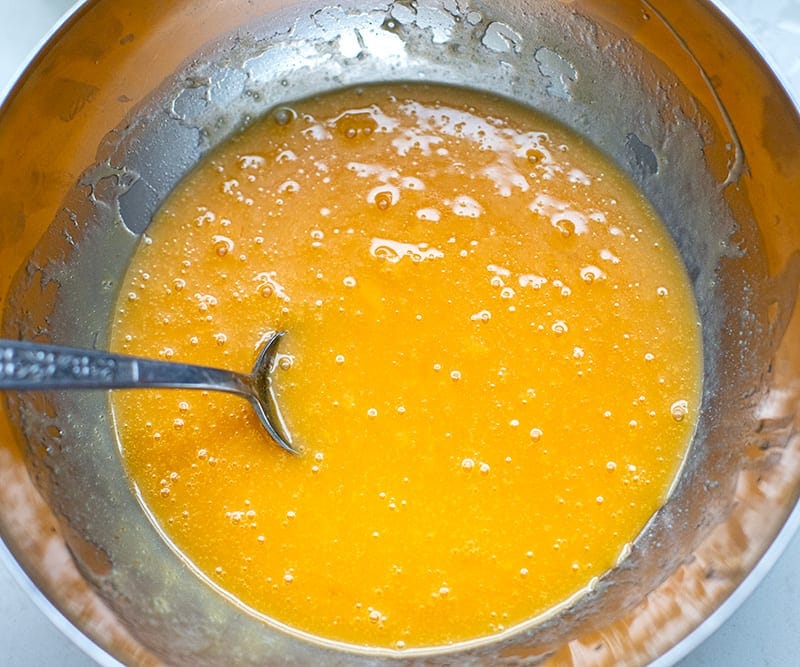 Butter and eggs mixed together for apple cake