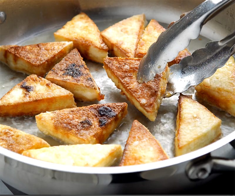 Fried tofu in a pan