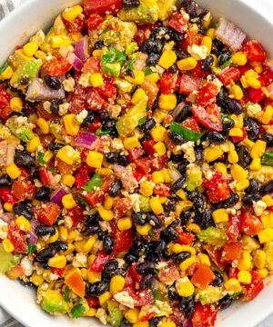 Mexican Salad (Fiesta Salad) with black beans, corn, avocado, and tomatoes