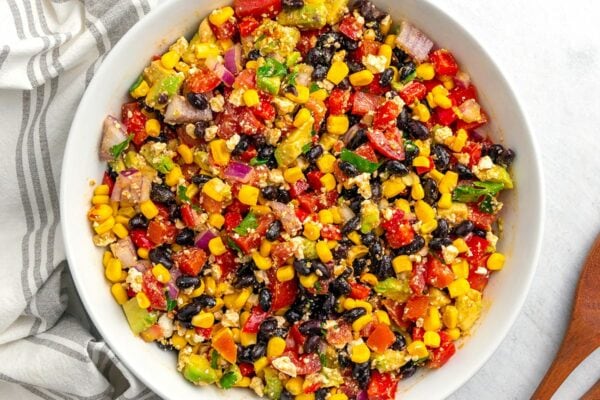 Mexican Salad (Fiesta Salad) with black beans, corn, avocado, and tomatoes