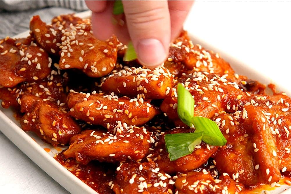 Garnish chicken with green onions