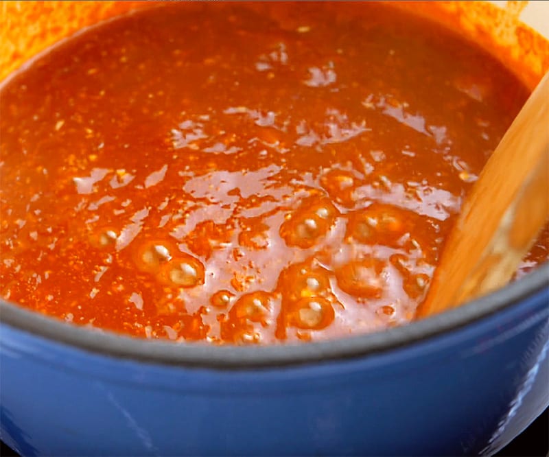 Chili sauce bubbling in a pot