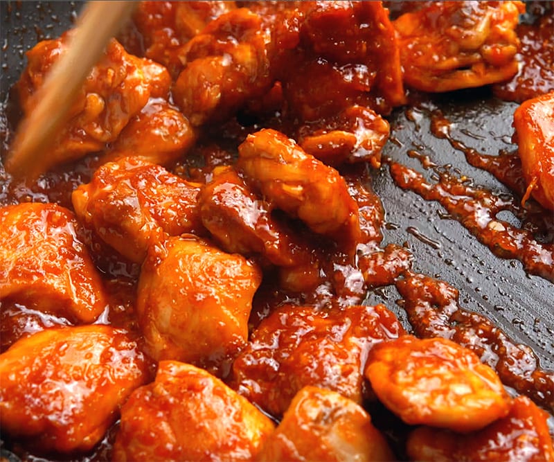 Cook chicken in chili sauce until caramelized