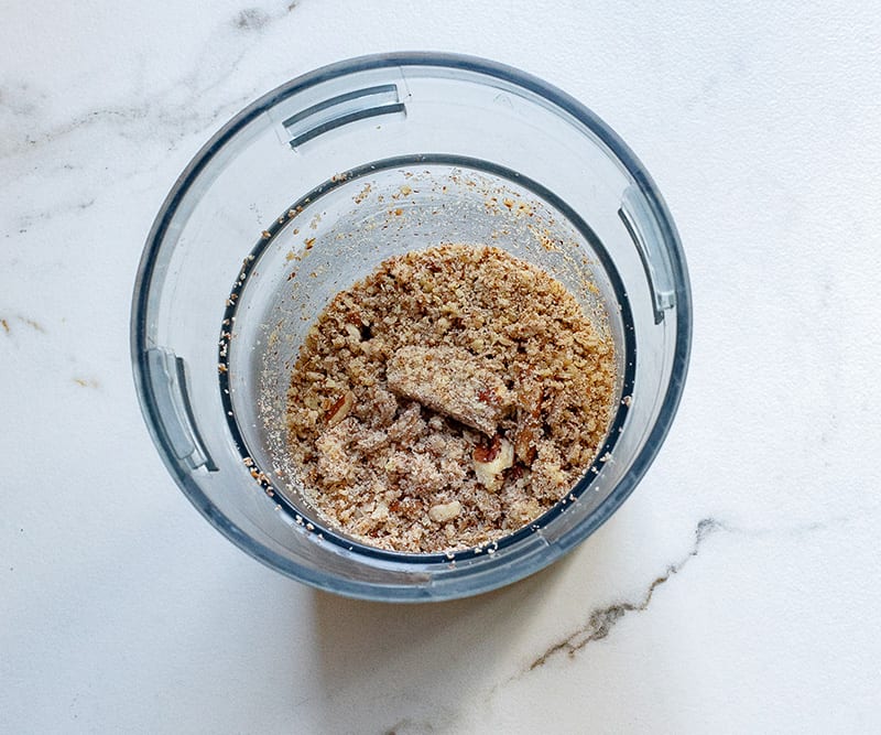 Crush pecans in a food processor