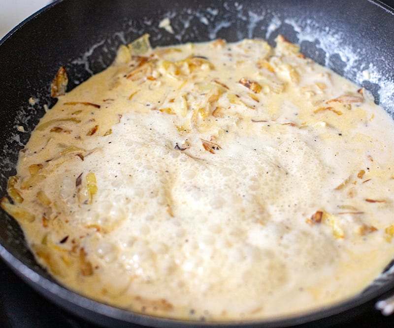 Cooking cream sauce in a skillet