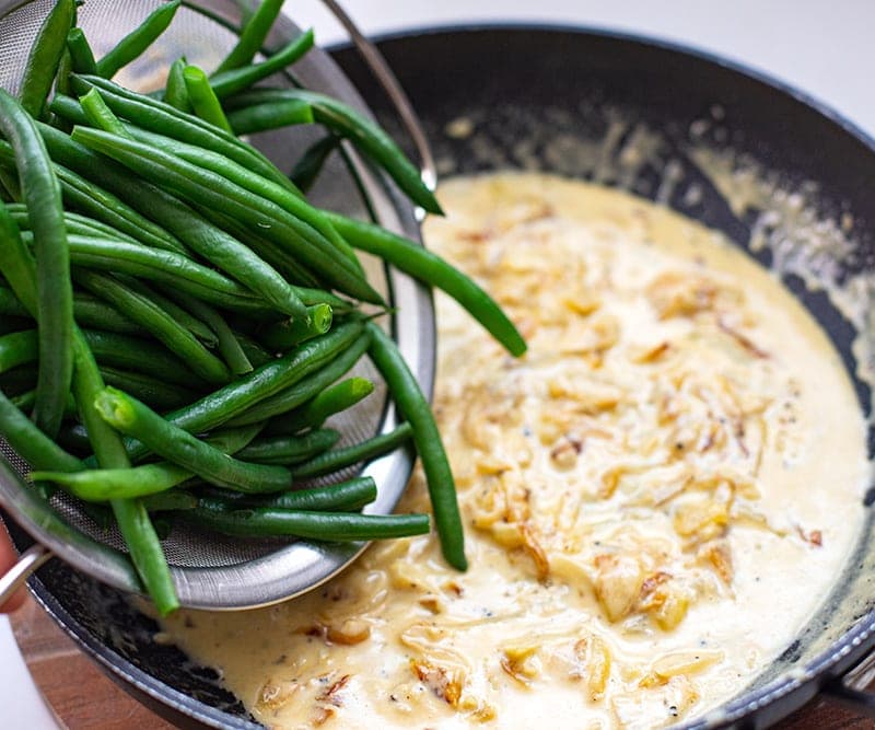 Add beans to creamy onion garlic sauce