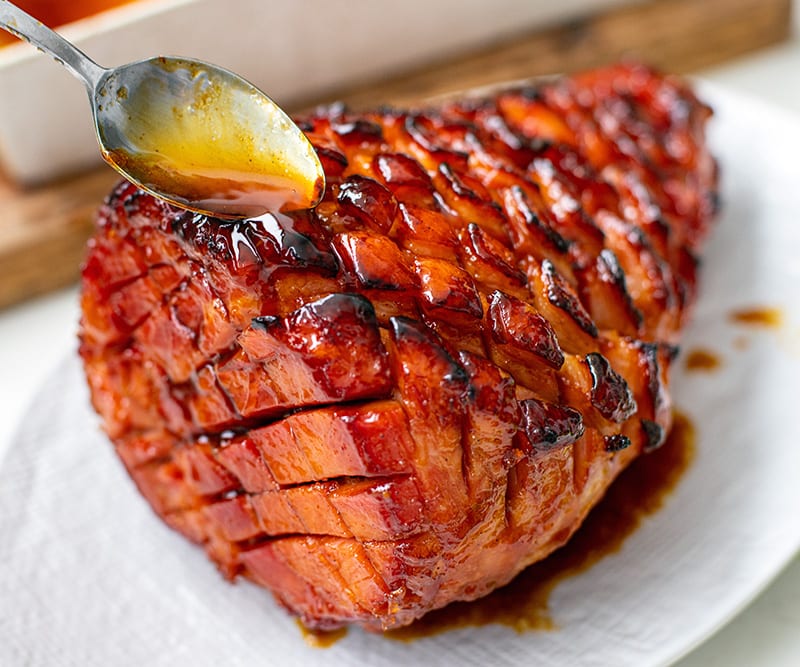 Baked glazed ham on a platter