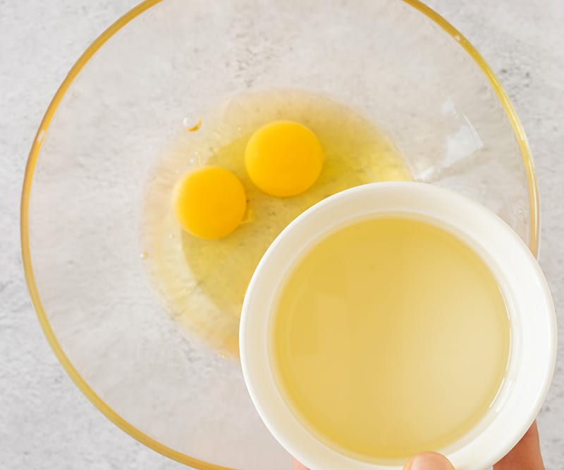 Mix eggs with oil