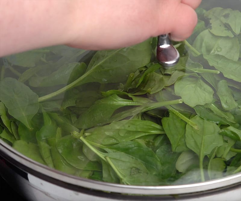 steam spinach under a lid