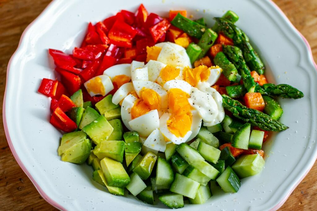 Healthy Egg Salad With Avocado, Asparagus, Red Peppers and cucumbers