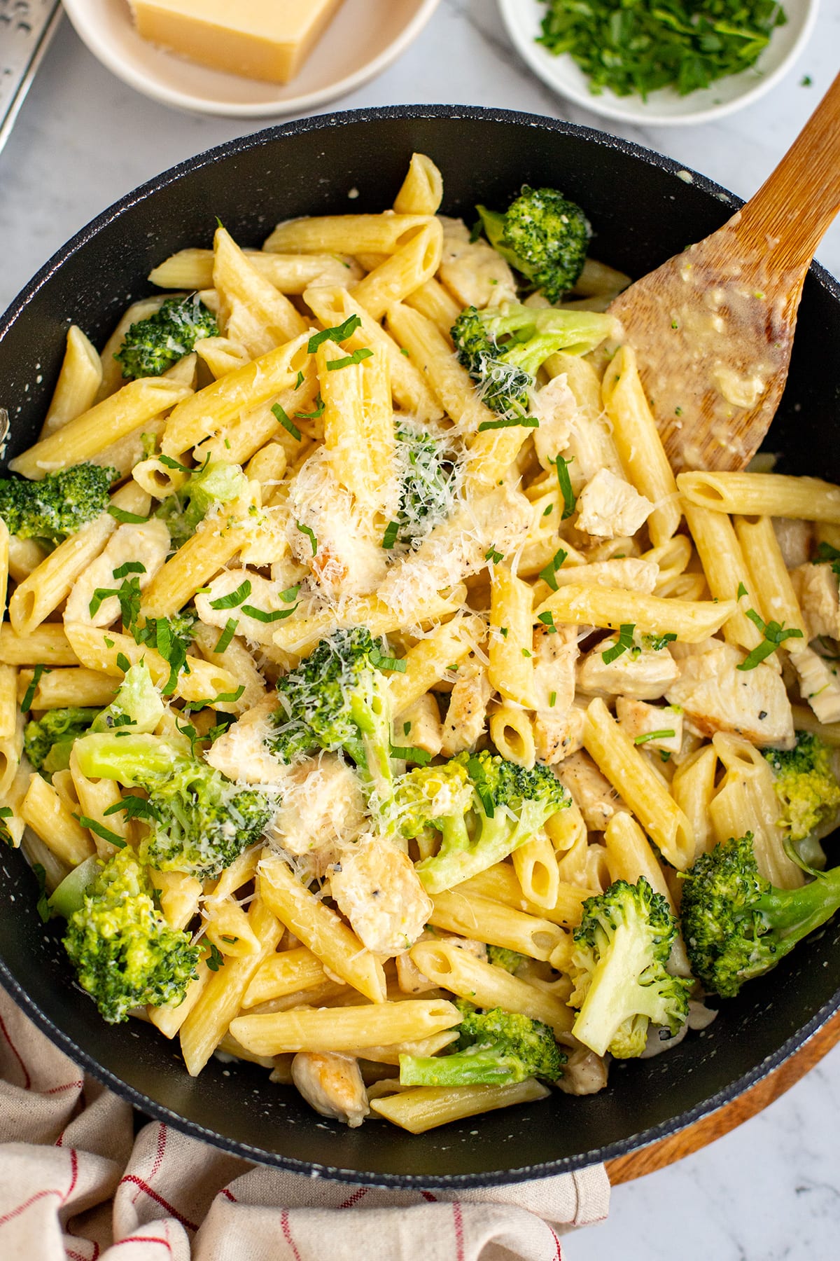 Chicken Broccoli Alfredo Recipe With Penne pasta in a skillet.