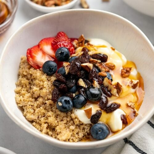 Quinoa breakfast bowl with Greek yogurt, berries, honey and nuts