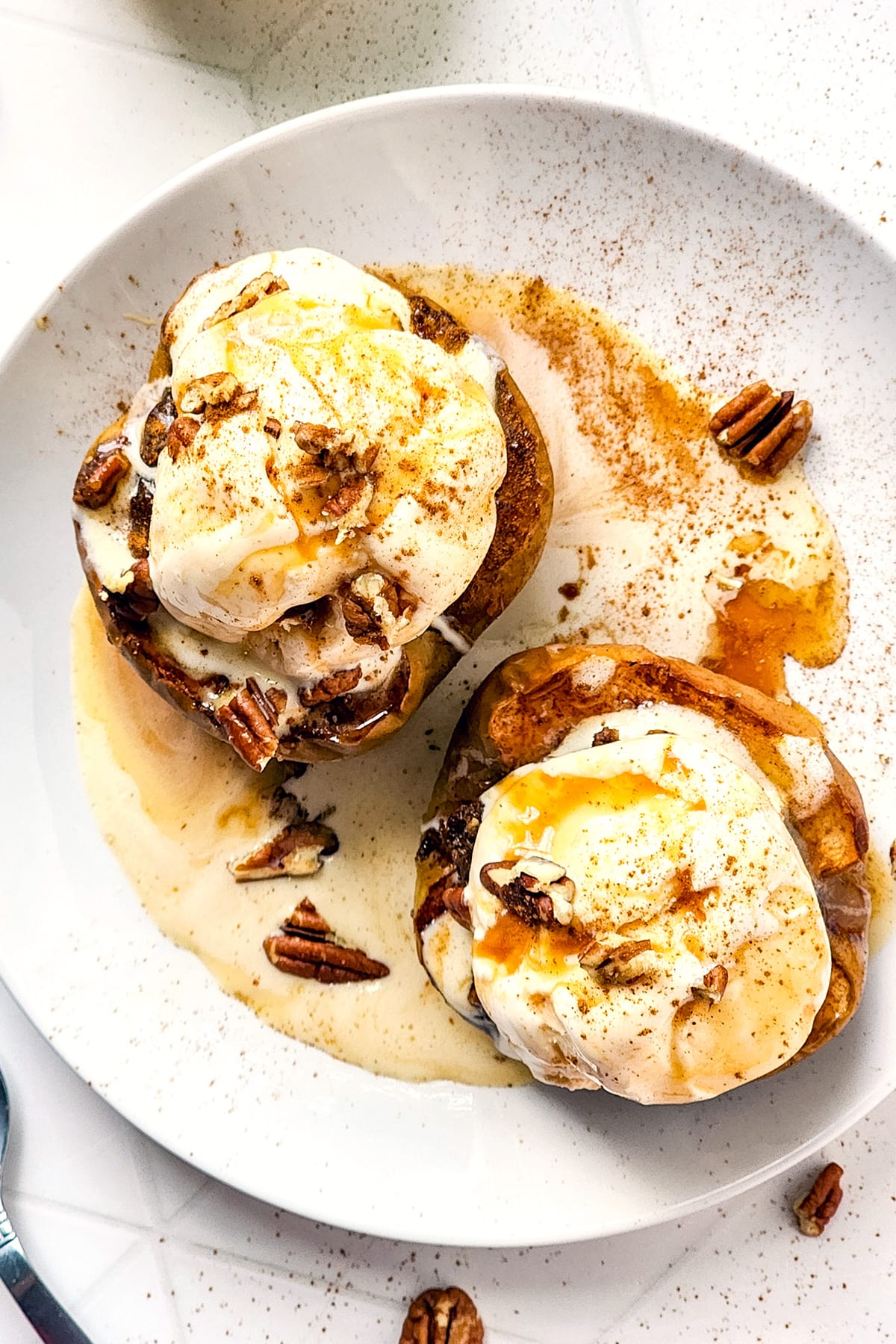 baked cinnamon apples with ice cream on top.