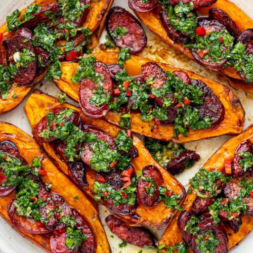 Roasted sweet potato halves with grilled chorizo and chimichurri, inspired by choripan recipe