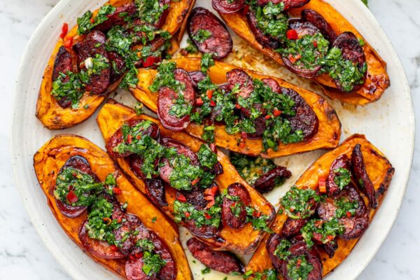 Roasted sweet potato halves with grilled chorizo and chimichurri, inspired by choripan recipe