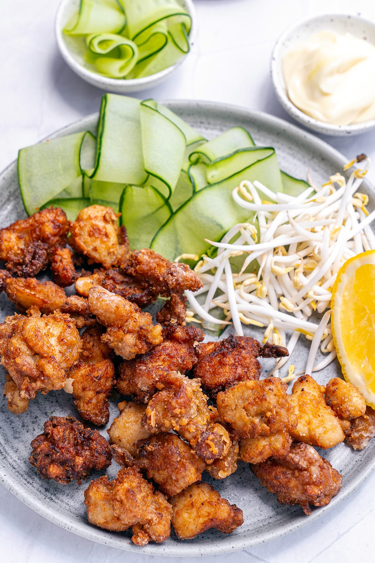 Chicken karaage recipe with sauce and cucumbers