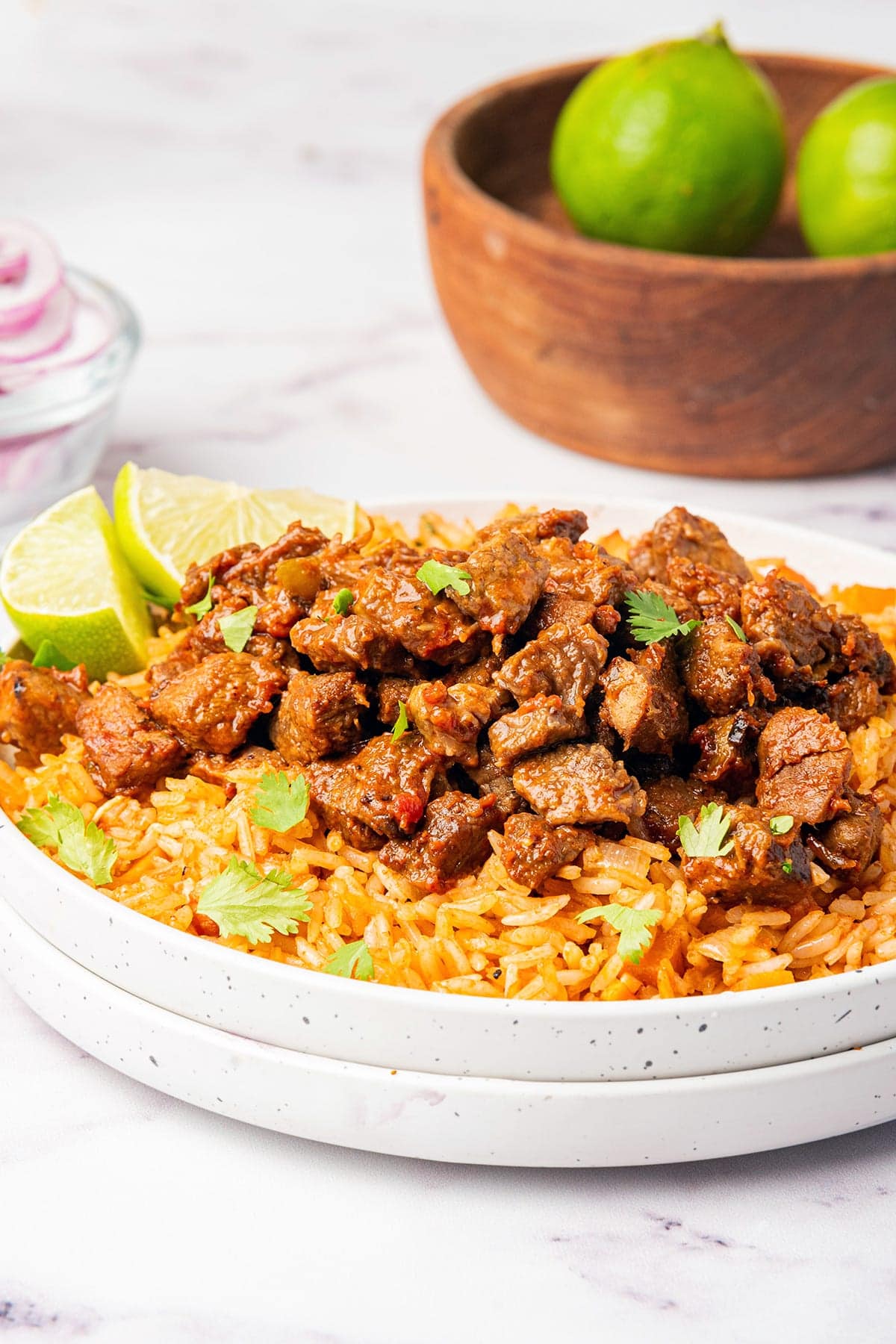 Carne picada (spicy beef) on a plate with red rice