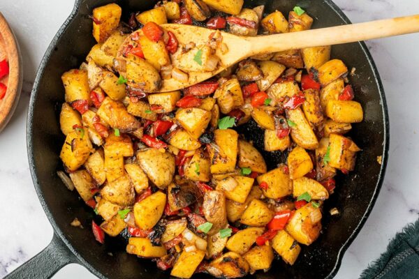 Country potatoes fried in a skillet feature