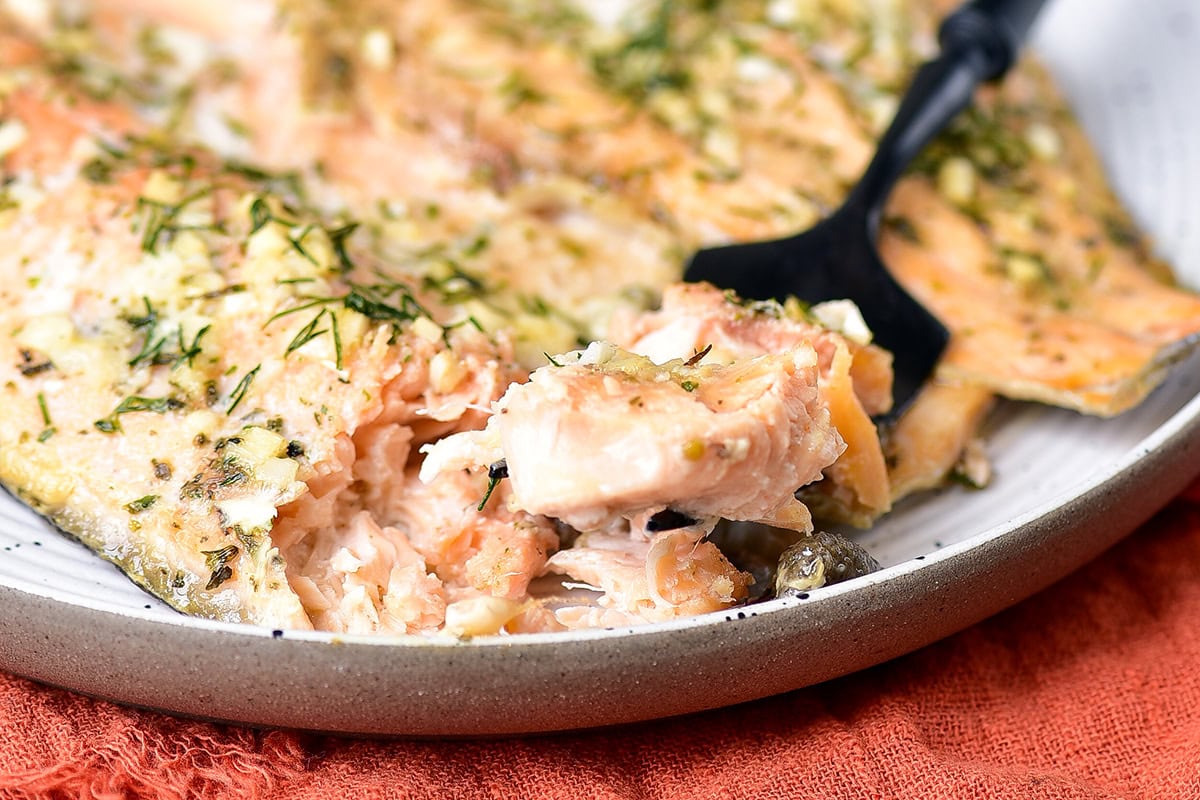 Baked trout recipe with garlic butter close up shot