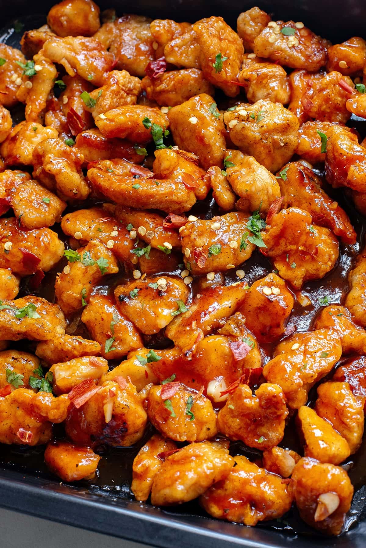 Honey sriracha chicken bites baked in the oven tray