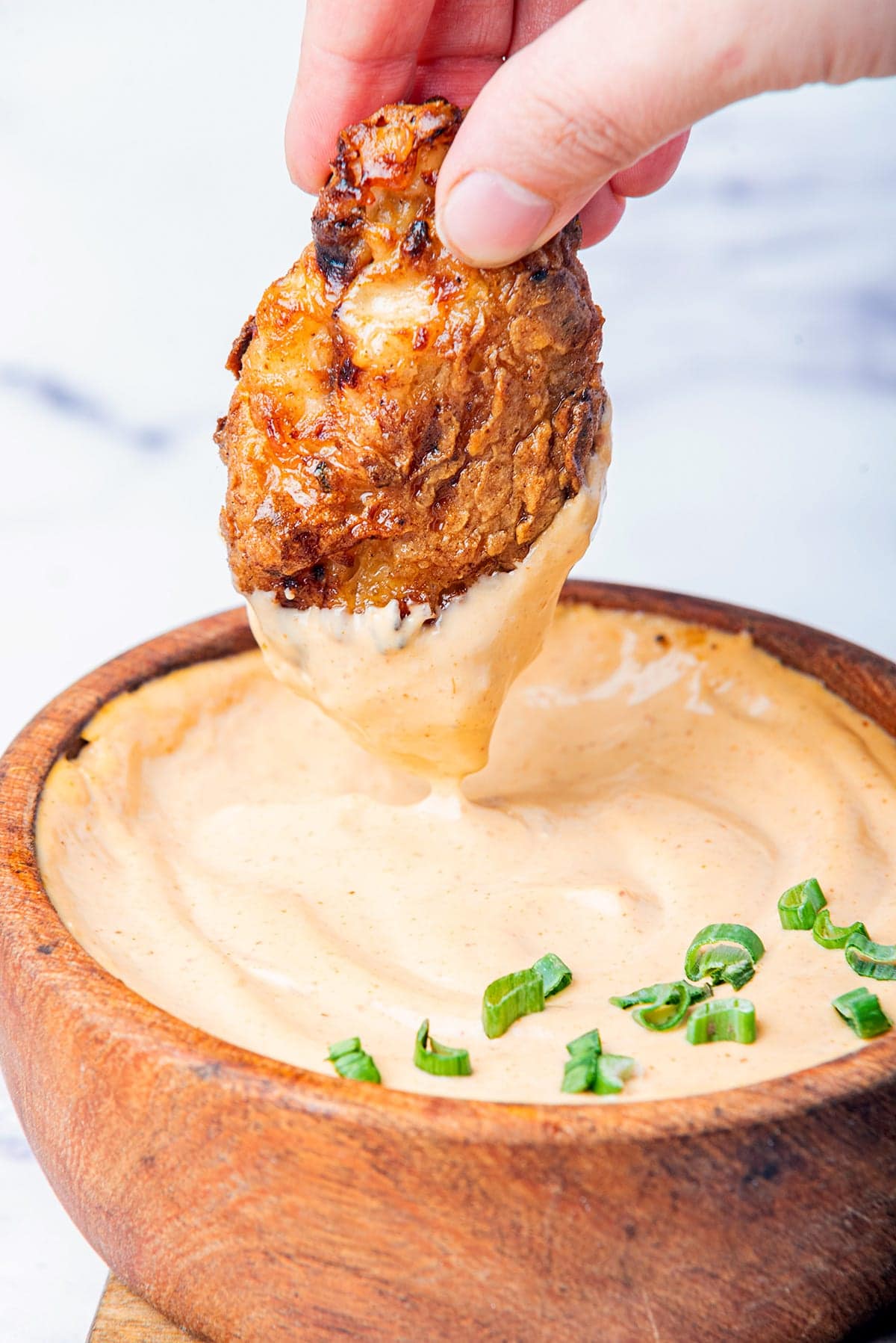 Bang bang sauce recipe with chicken dipped into it.