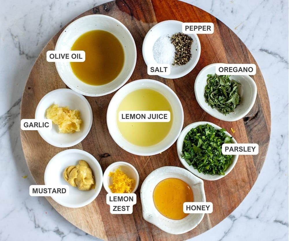 Greek marinade for pork skewers, ingredients in small bowls