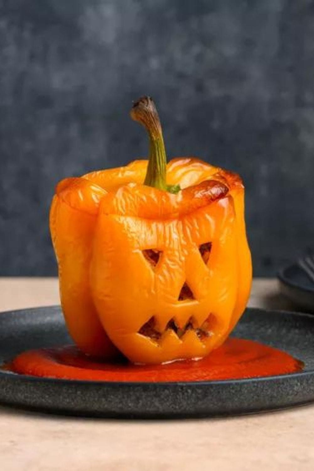 Jack-O’-Lantern Stuffed Peppers