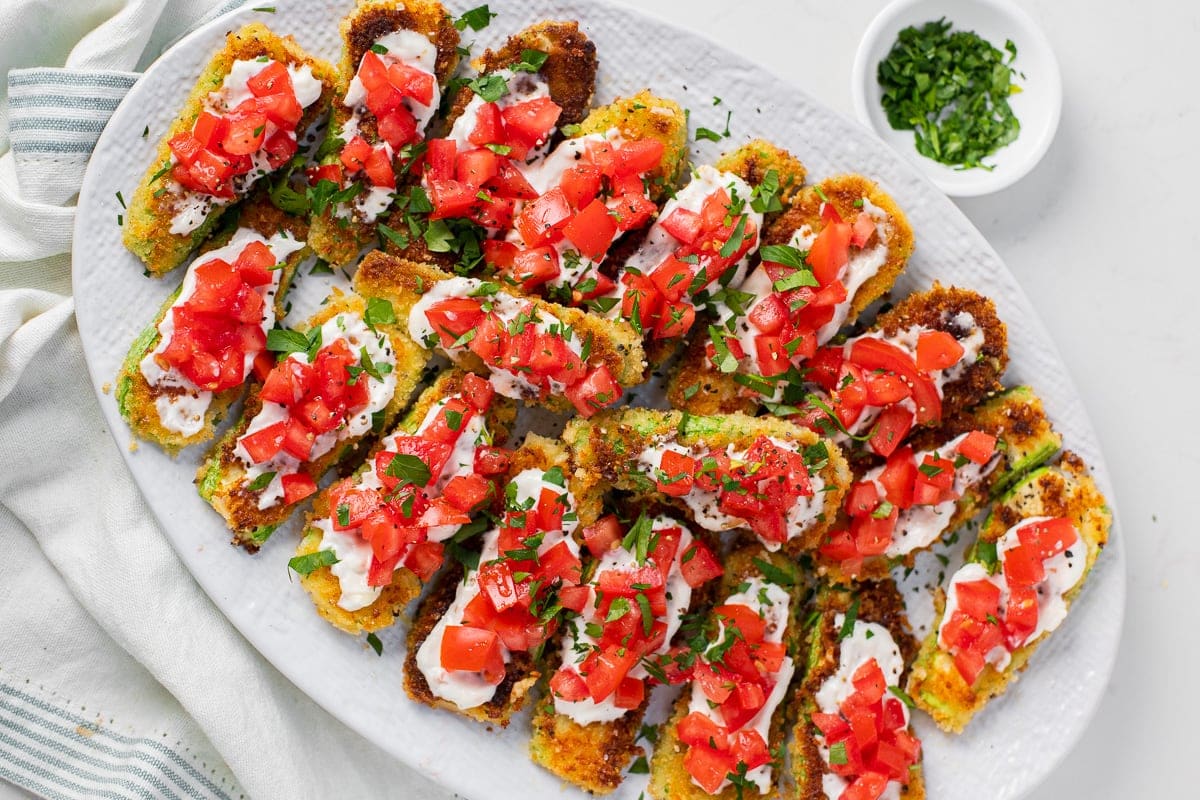 Parmesan crusted zucchini with aioli and tomatoes feature