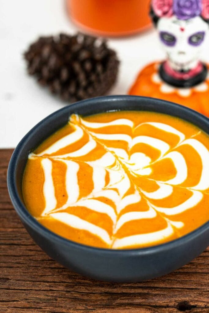 Spooky Halloween Spiderweb Carrot Soup
