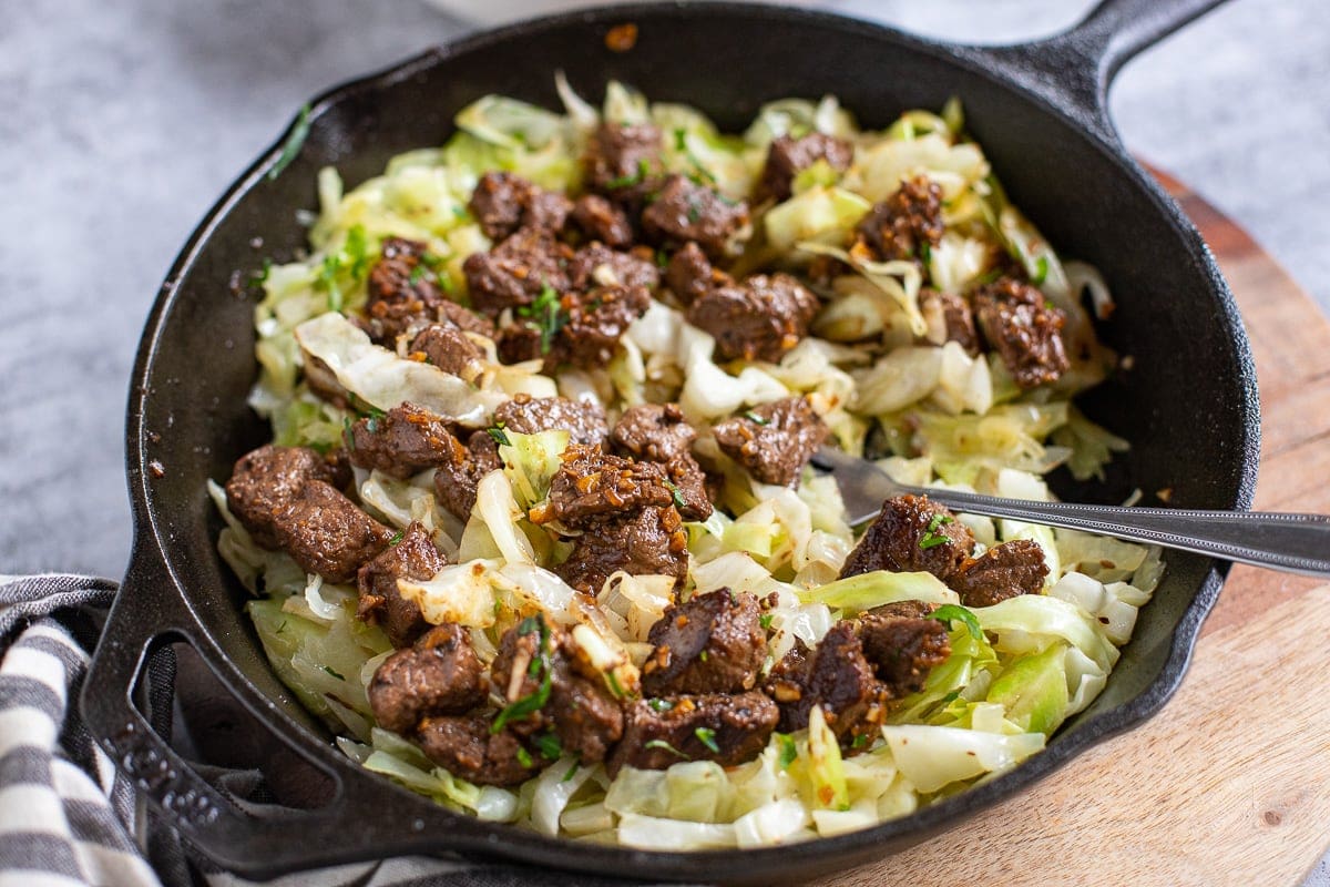 steak recipes with garlic butter and sautéed cabbage.