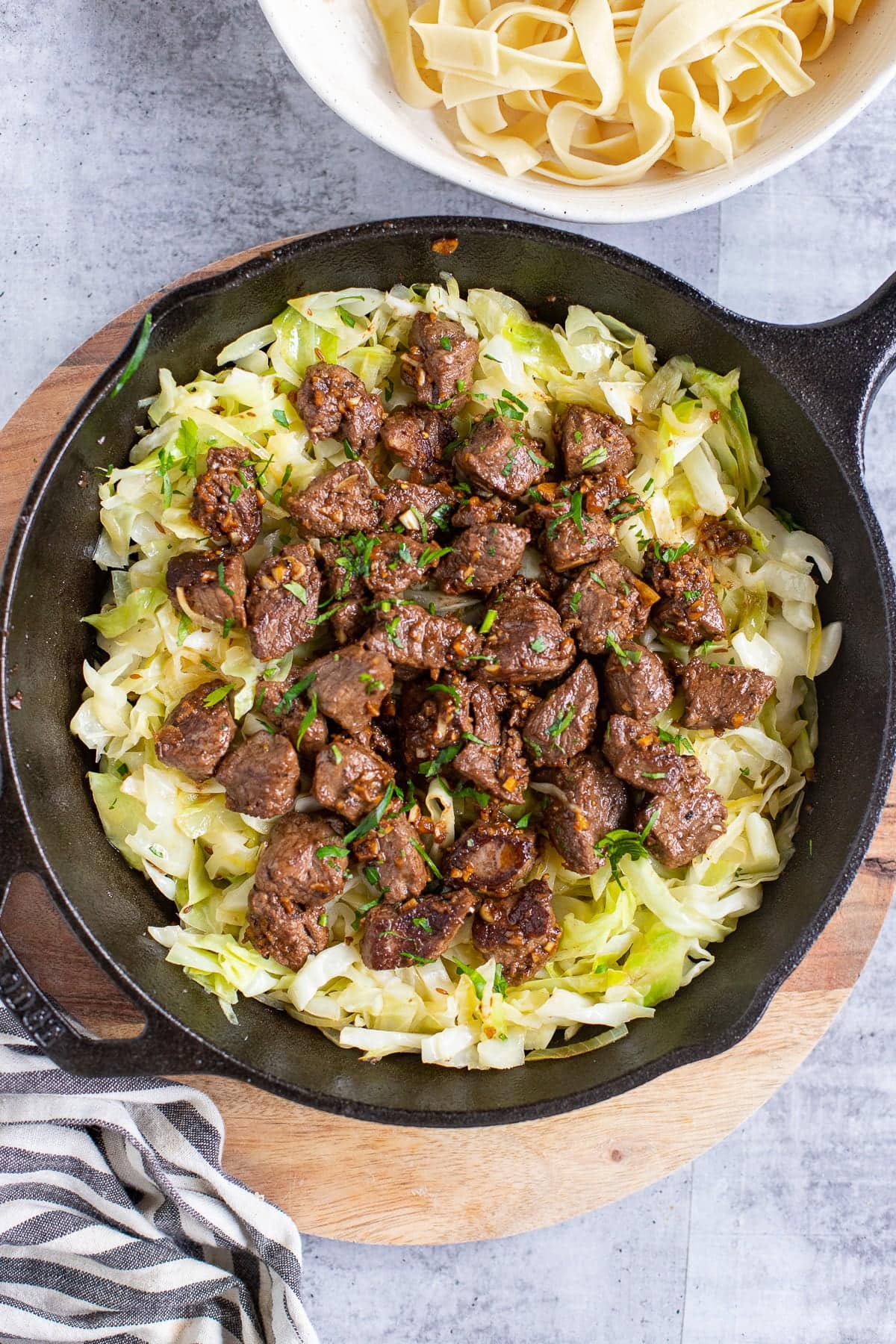 Garlic steak bites with sautéed cabbage.