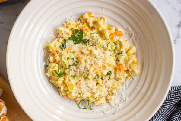 low carb Cauliflower risotto with parmesan cheese on top.