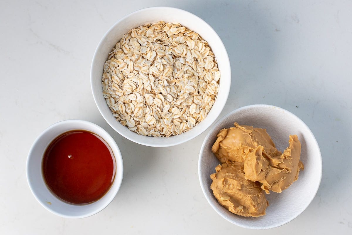 Ingredients for the recipe including peanut butter, oatmeal, and maple.