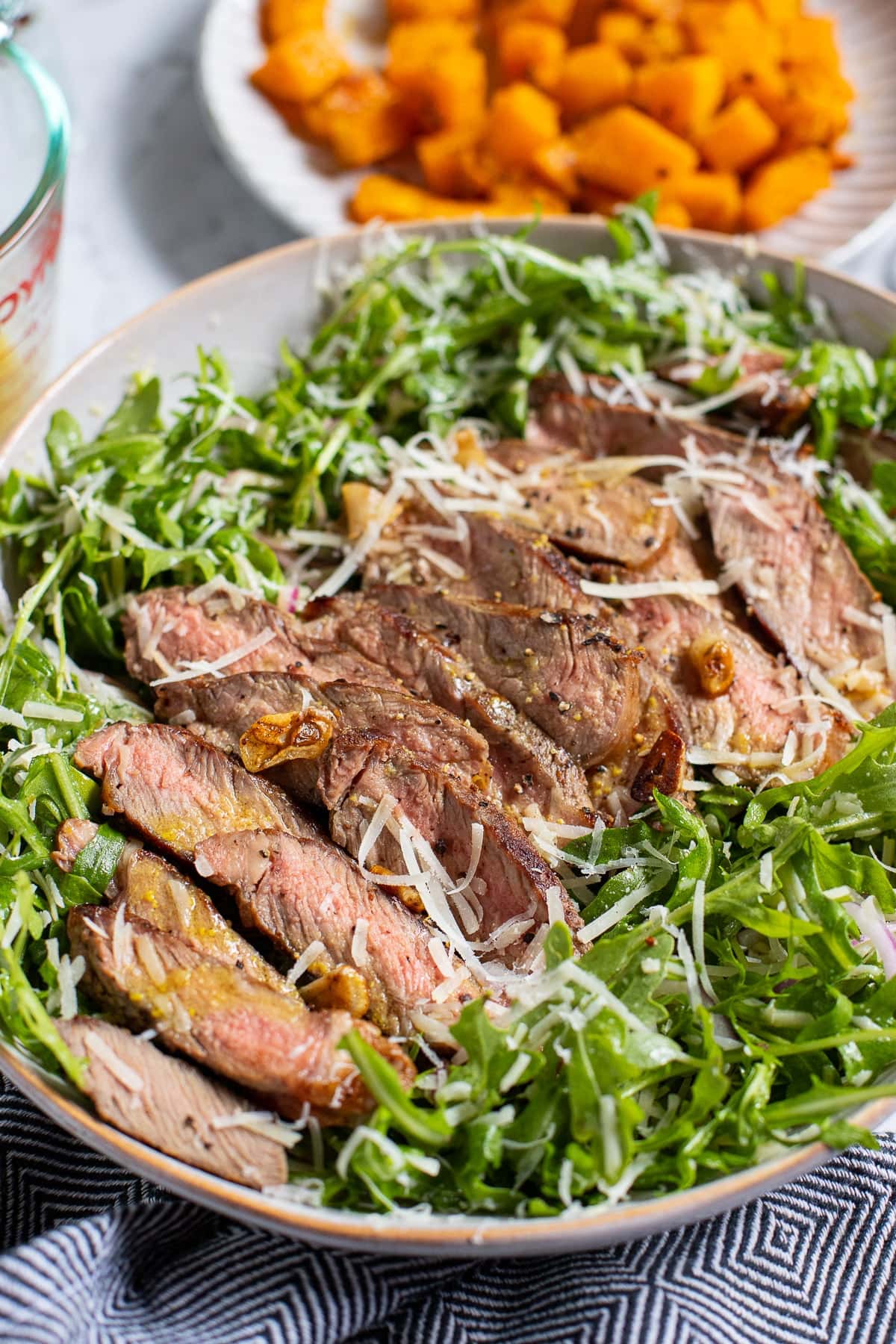 Arugula Steak Salad with Parmesan and honey lemon dressing.
