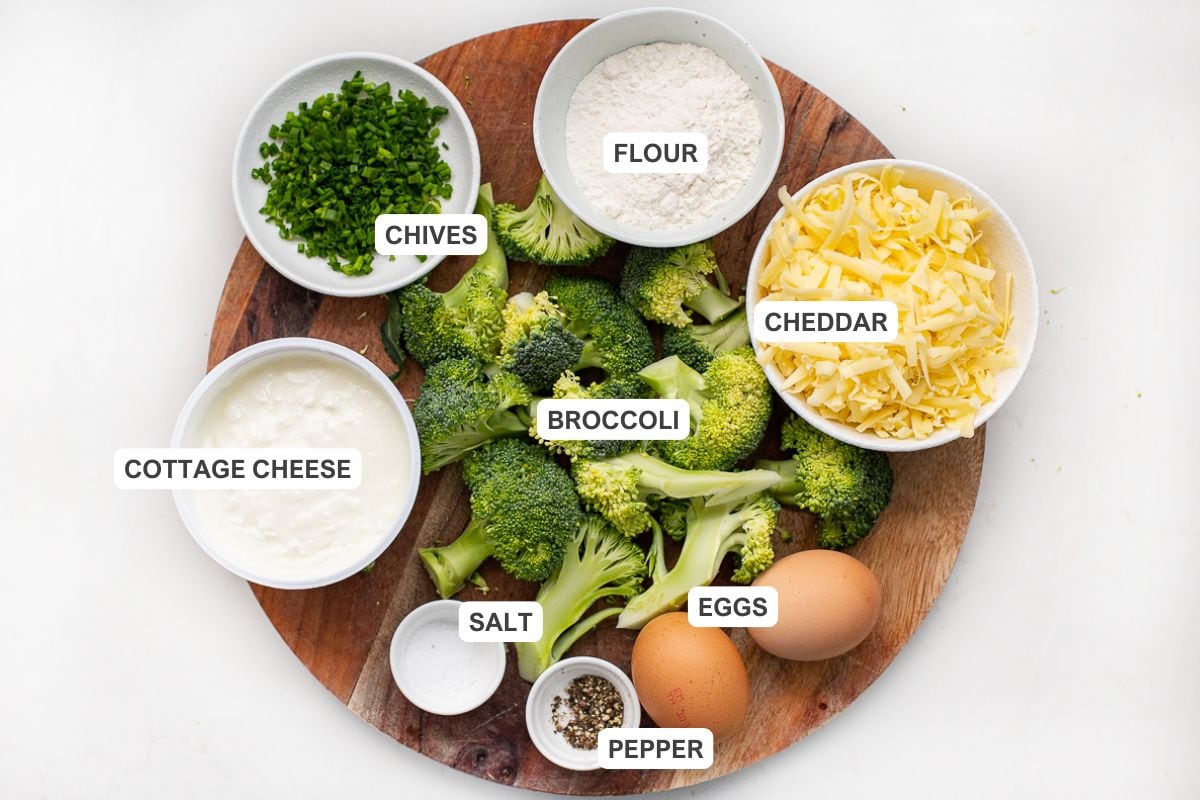 Ingredients for the recipe including broccoli, cheddar, flour, chives, cottage cheese, salt, eggs, and pepper.