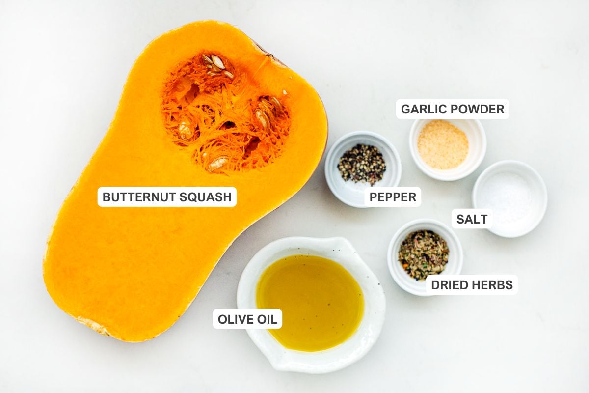Ingredients for the recipe including butternut squash, olive oil, salt, pepper, dried herbs, and garlic powder.