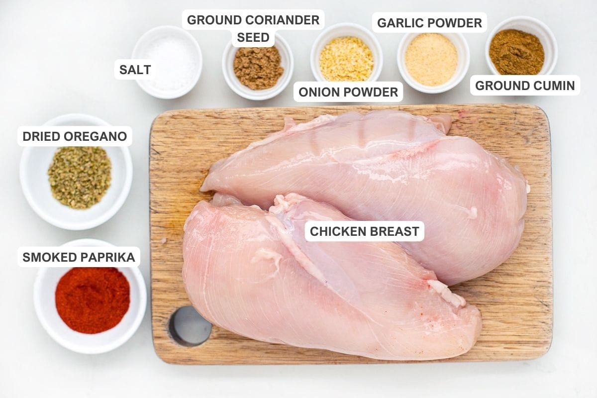Ingredients for the recipe including chicken, salt, garlic powder, onion powder, dried coriander, ground cumin, ground coriander seed, smoked paprika, and olive oil.