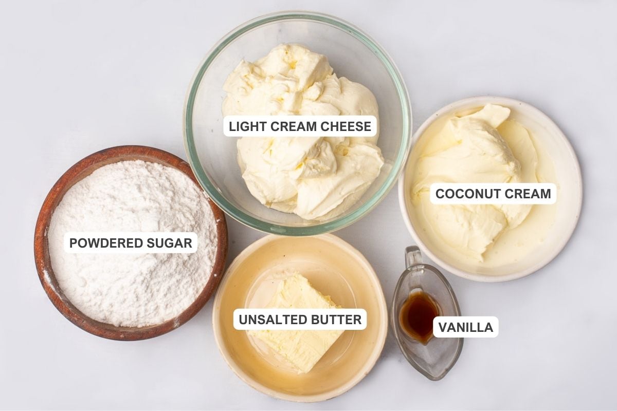 Ingredients for the frosting including unsalted butter, cream cheese, coconut cream, powdered sugar, and vanilla extract.