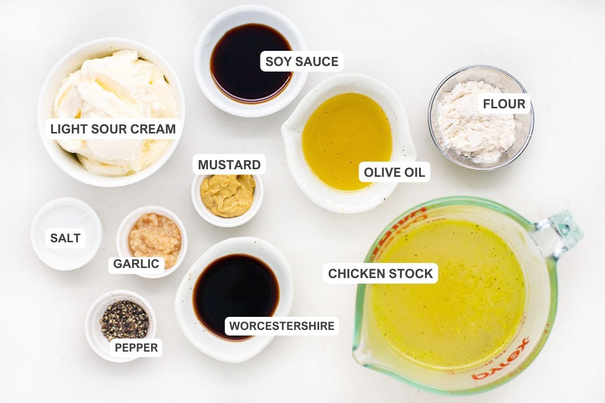 Ingredients for the recipe including light sour cream, chicken stock, salt, garlic, pepper, mustard, olive oil, worcestershire, and soy sauce.