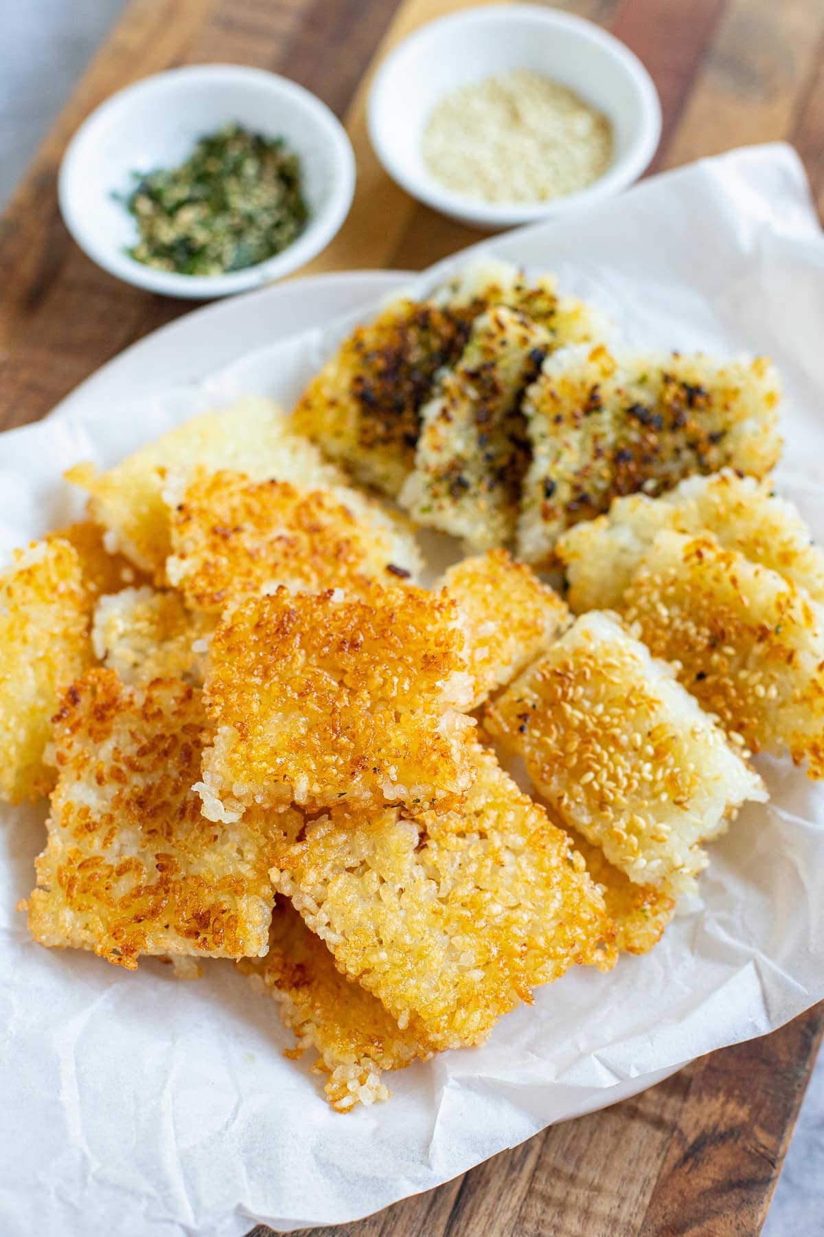 crispy rice bites, some with sesame seeds and furikake.