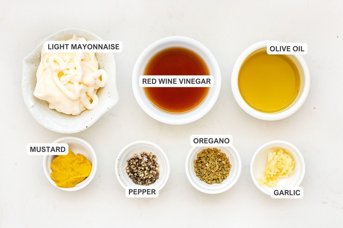 Ingredients for the recipe including light mayonnaise, red wine vinegar, olive oil, mustard, pepper, oregano, and garlic.